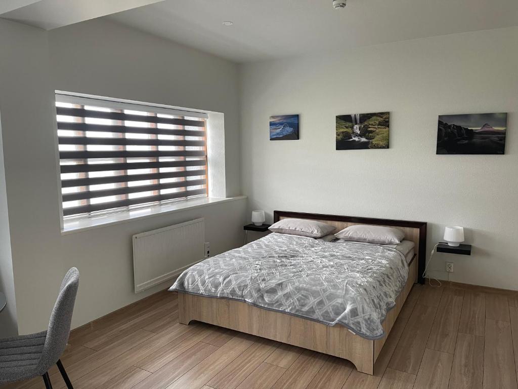 Postel nebo postele na pokoji v ubytování Helgrindur Guesthouse