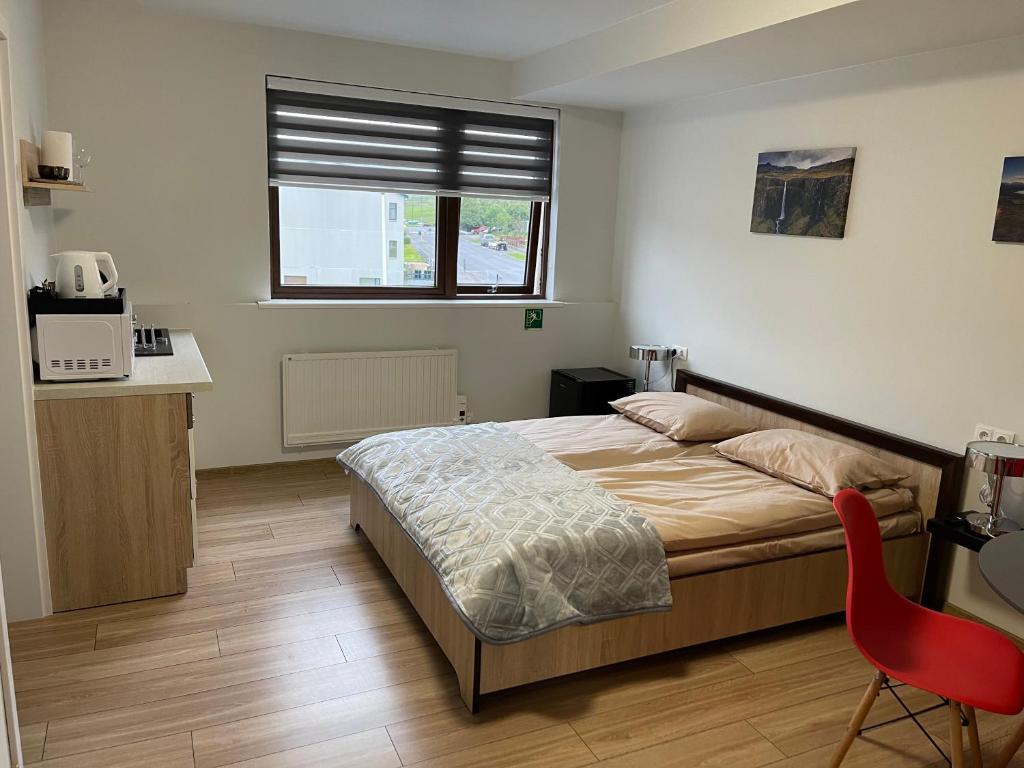 Postel nebo postele na pokoji v ubytování Helgrindur Guesthouse