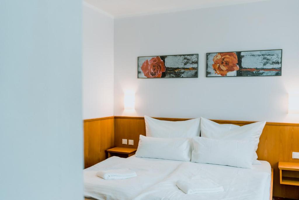 Postel nebo postele na pokoji v ubytování Prachárna Park Hotel Olomouc