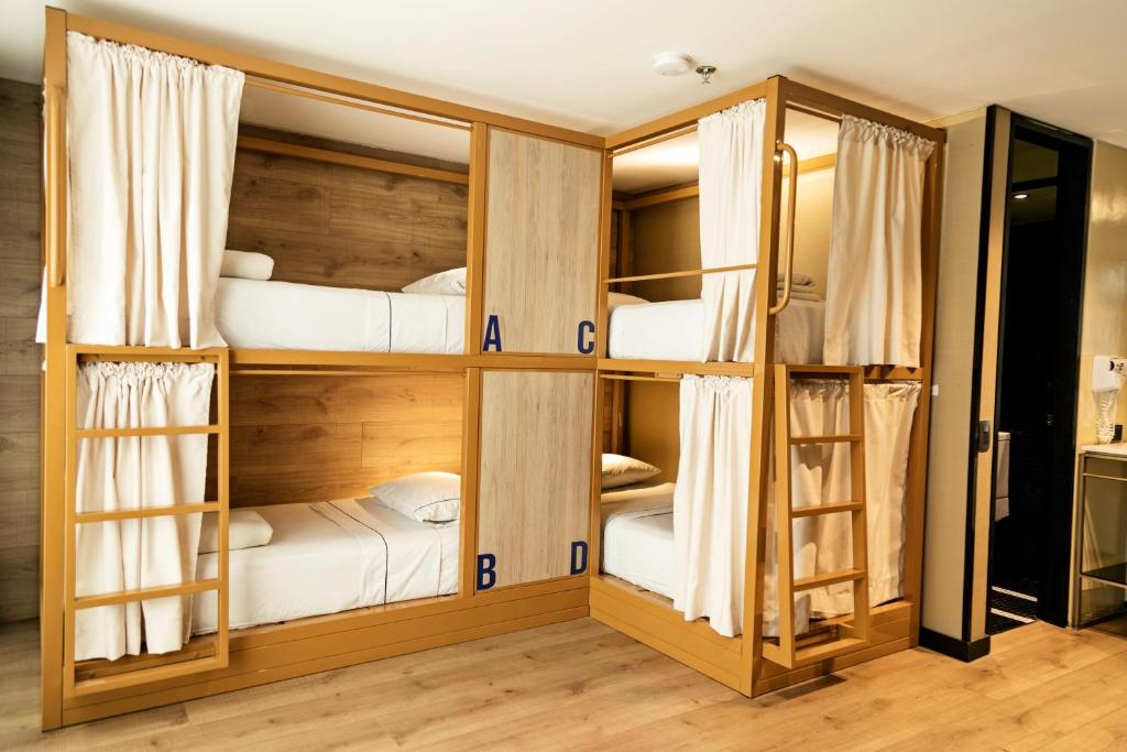 Postel nebo postele na pokoji v ubytování Viajero Bogotá Hostel & Spa