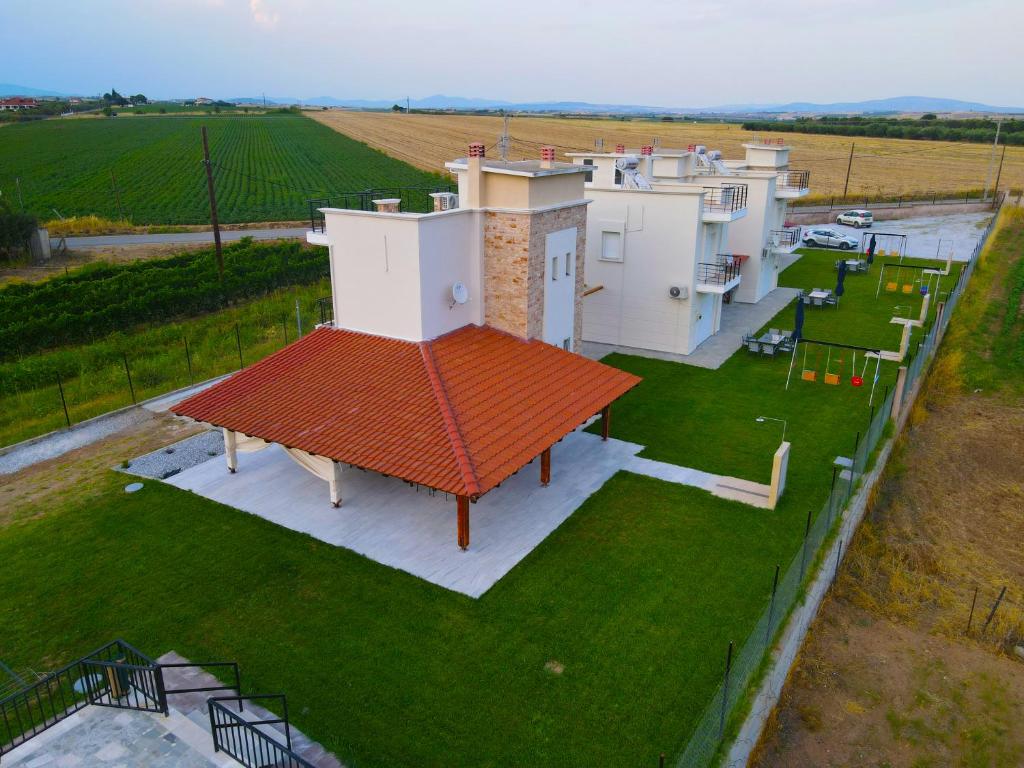 an overhead view of a house with a red roof at Mythic Villas in Epanomi