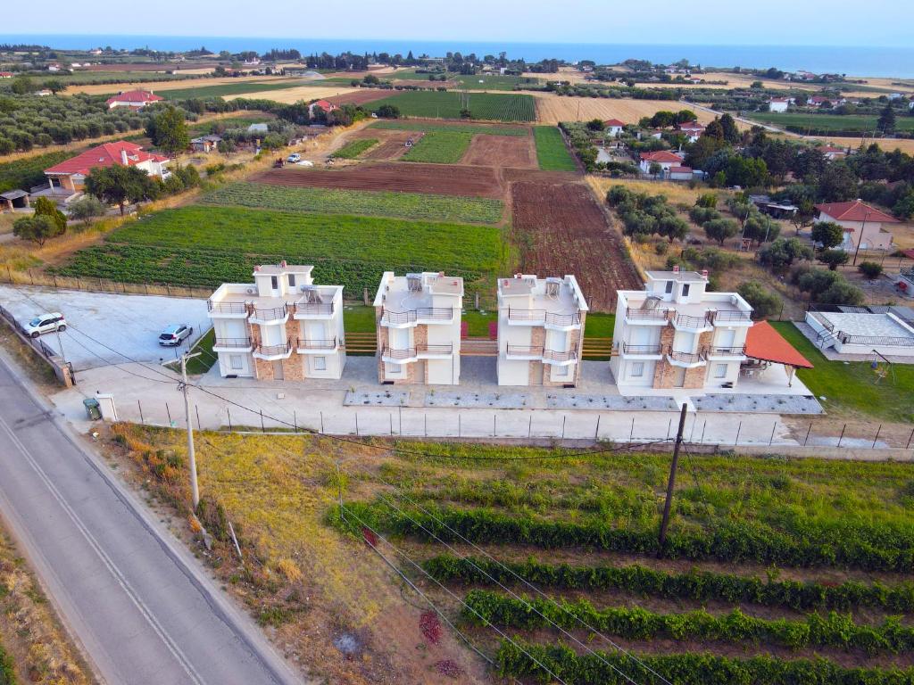 an aerial view of a building next to a road at Mythic Villas in Epanomi