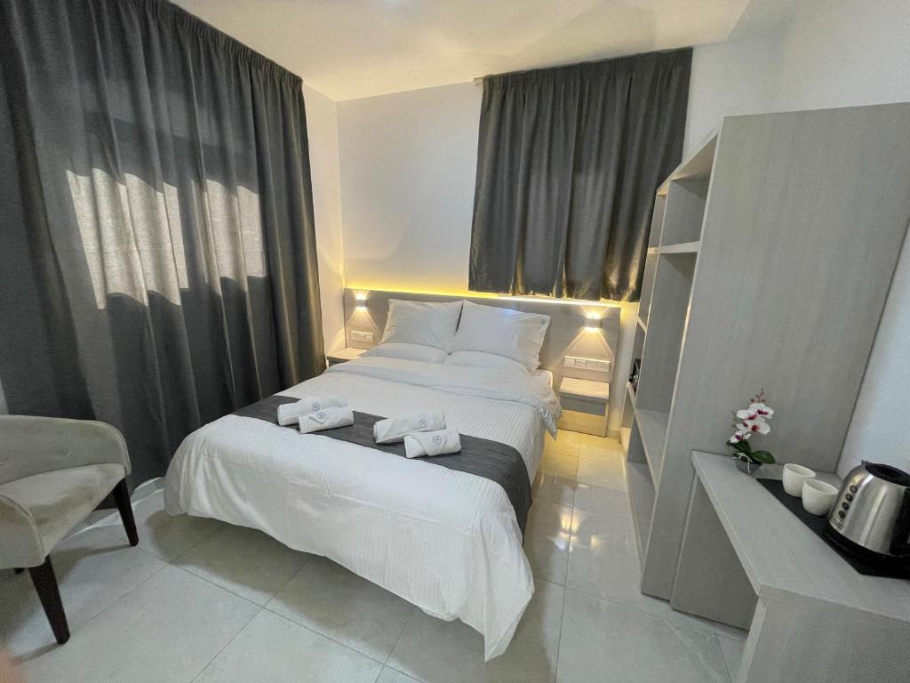 Cama ou camas em um quarto em La Veranda Hotel