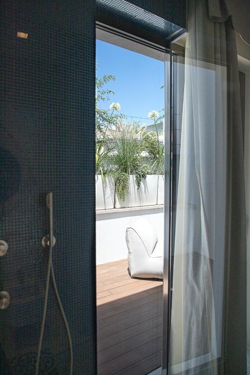 A balcony or terrace at Ognissanti Restaurant Spa Hotel Rooftop