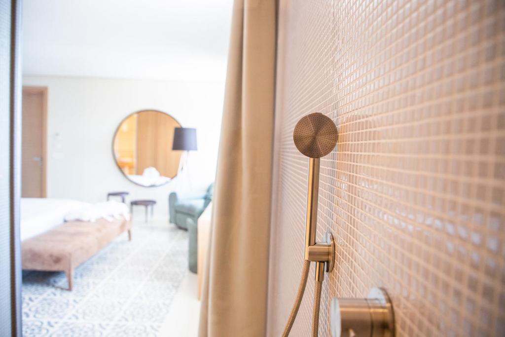 A bed or beds in a room at Ognissanti Restaurant Spa Hotel Rooftop