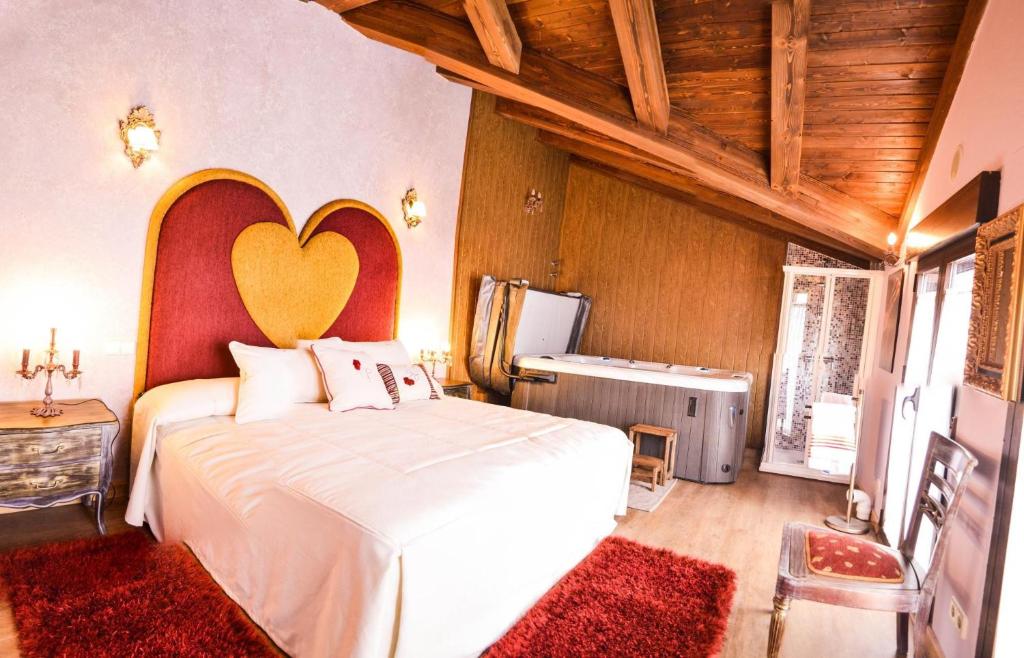 Ένα ή περισσότερα κρεβάτια σε δωμάτιο στο El Carmen Exclusive