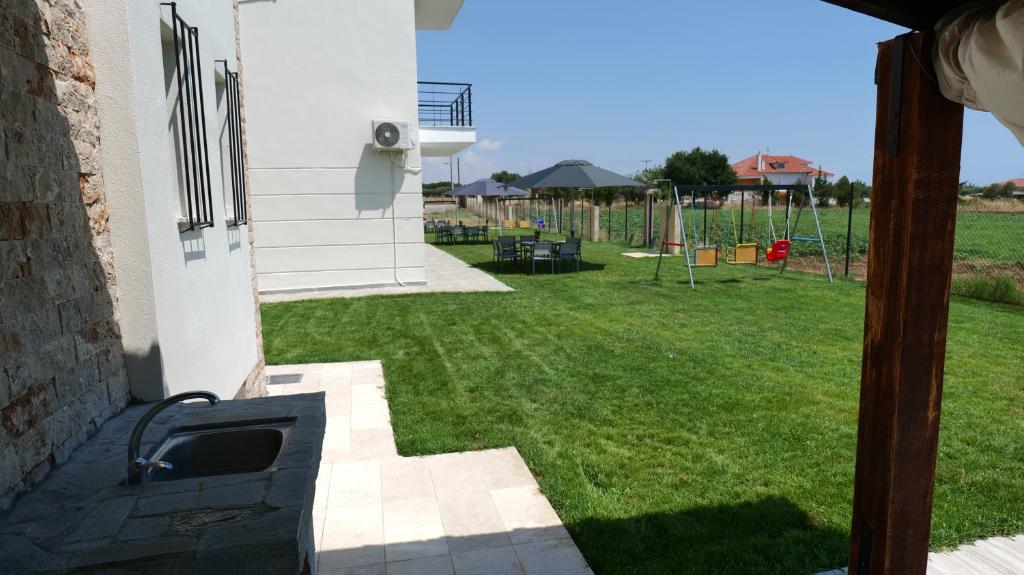 a view of a yard from the outside of a house at Mythic Villas in Epanomi