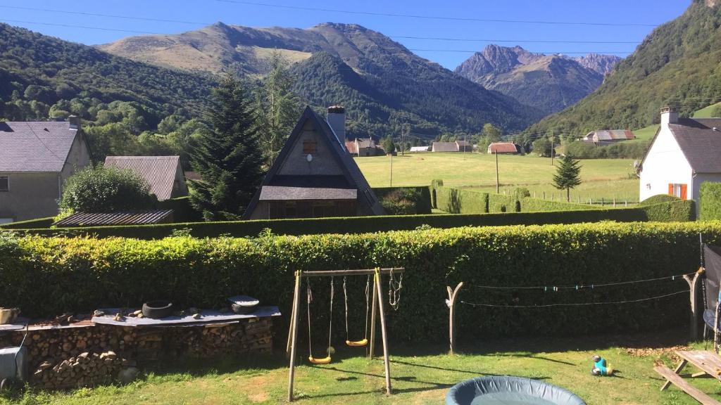 a view of a village with mountains in the background at Appartment tourmalet in Campan