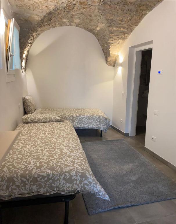 Postel nebo postele na pokoji v ubytování Castle Rhythm Inn
