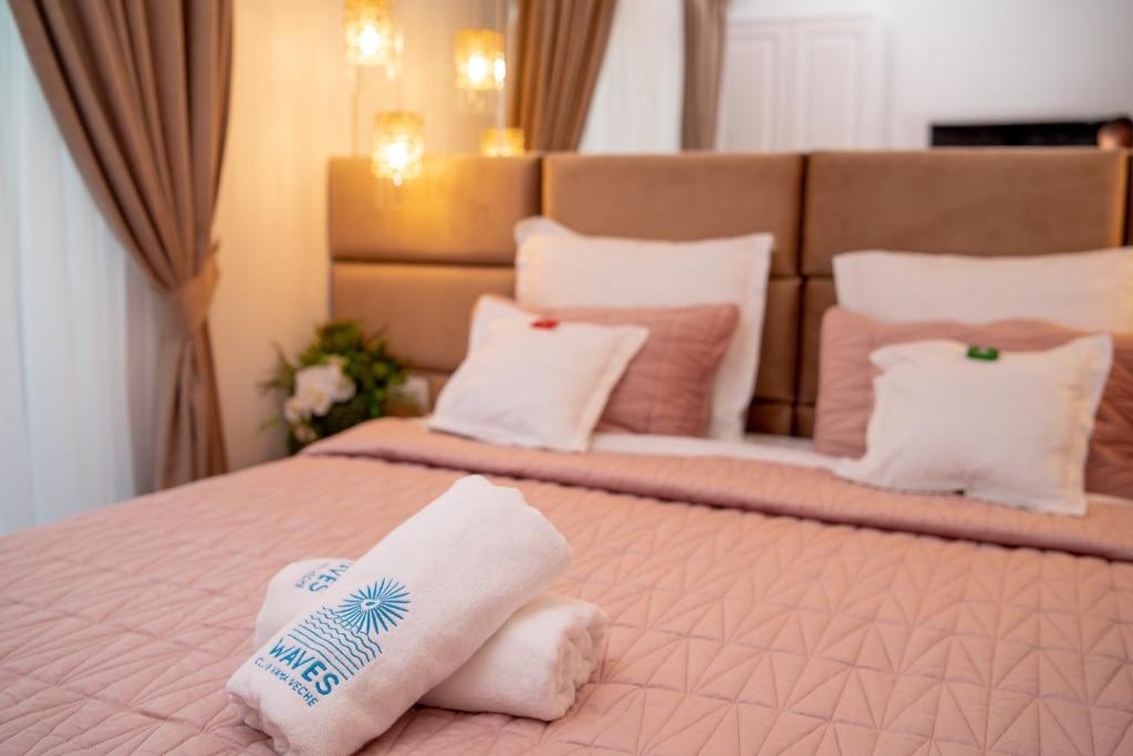 Postel nebo postele na pokoji v ubytování Club Waves - Vama Veche