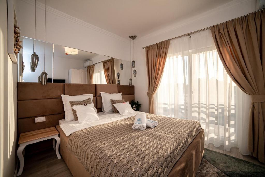 Postel nebo postele na pokoji v ubytování Club Waves - Vama Veche