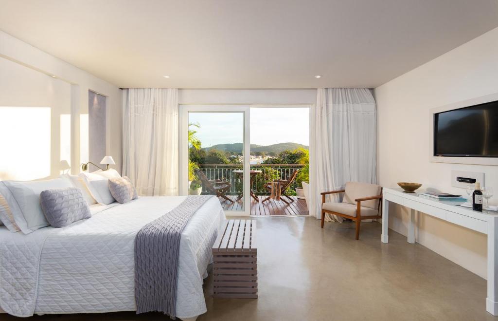 Postel nebo postele na pokoji v ubytování Abracadabra Boutique Hotel