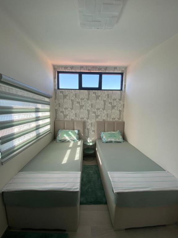Ένα ή περισσότερα κρεβάτια σε δωμάτιο στο Martin Lux Apartment