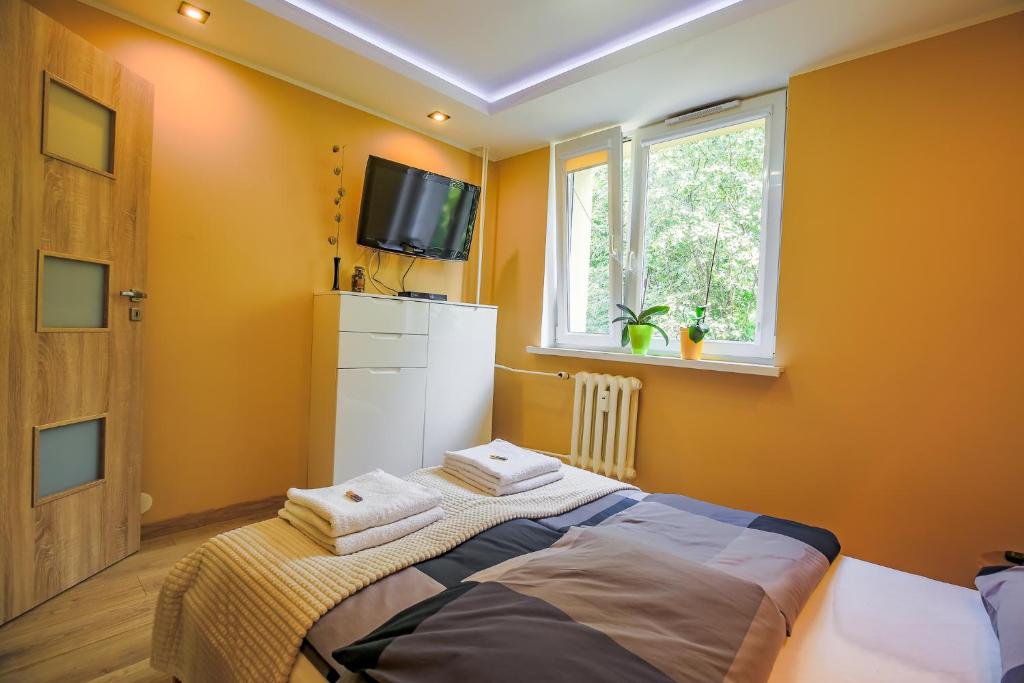 Postel nebo postele na pokoji v ubytování W CENTRUM