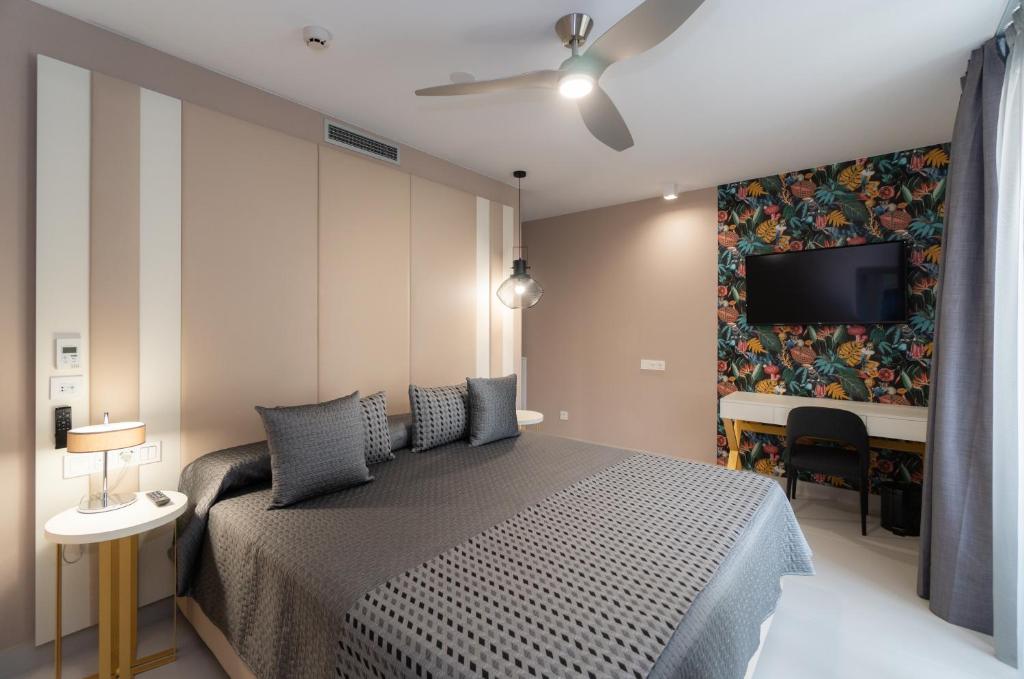 Postel nebo postele na pokoji v ubytování Hotel Perla del Sur