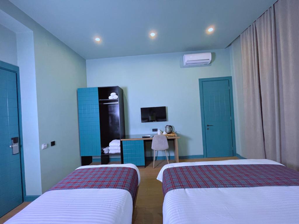 Postel nebo postele na pokoji v ubytování Green Rooms