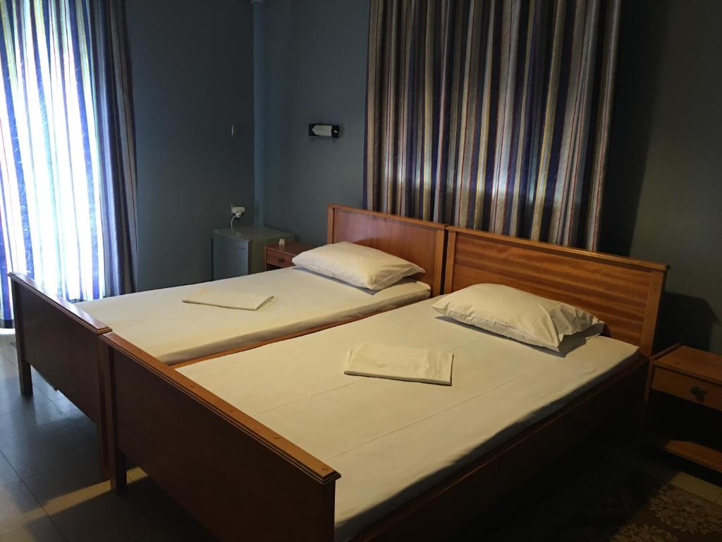 A bed or beds in a room at Artemis