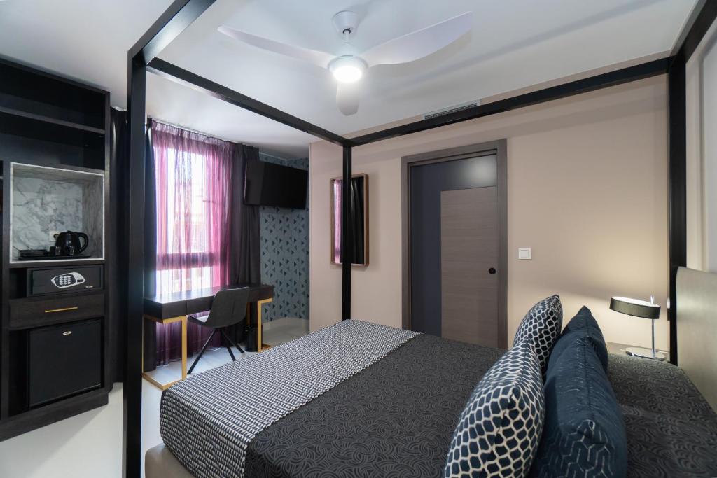 Postel nebo postele na pokoji v ubytování Hotel Perla del Sur