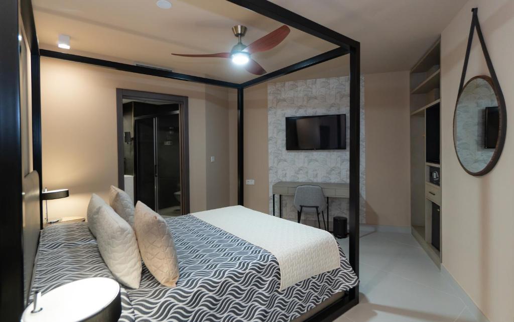 Postel nebo postele na pokoji v ubytování Hotel Perla del Sur