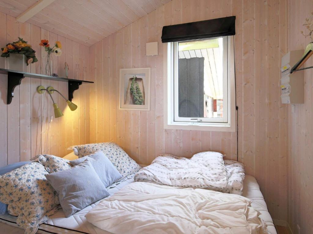 Postel nebo postele na pokoji v ubytování 4 person holiday home in Føllenslev-By Traum