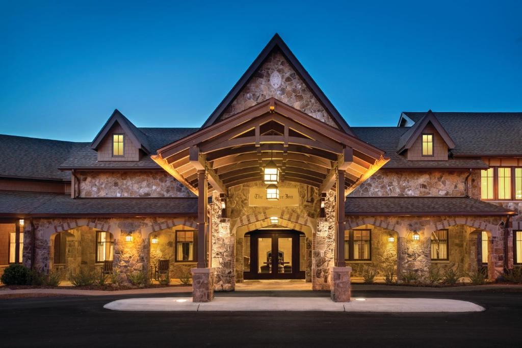 a large stone house with a gambrel roof at The Sewanee Inn in Sewanee