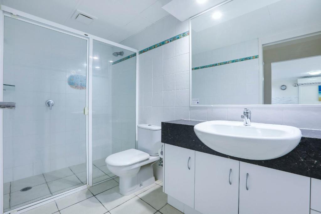 a bathroom with a toilet and a sink and a shower at The Breakers in Gold Coast