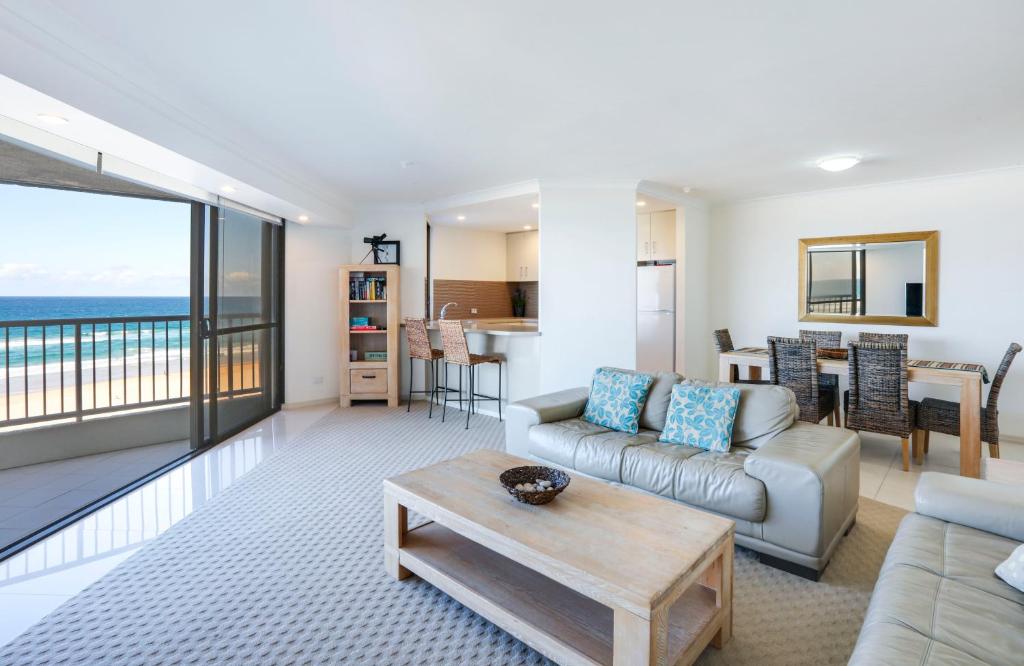 a living room with a couch and a table at The Breakers in Gold Coast