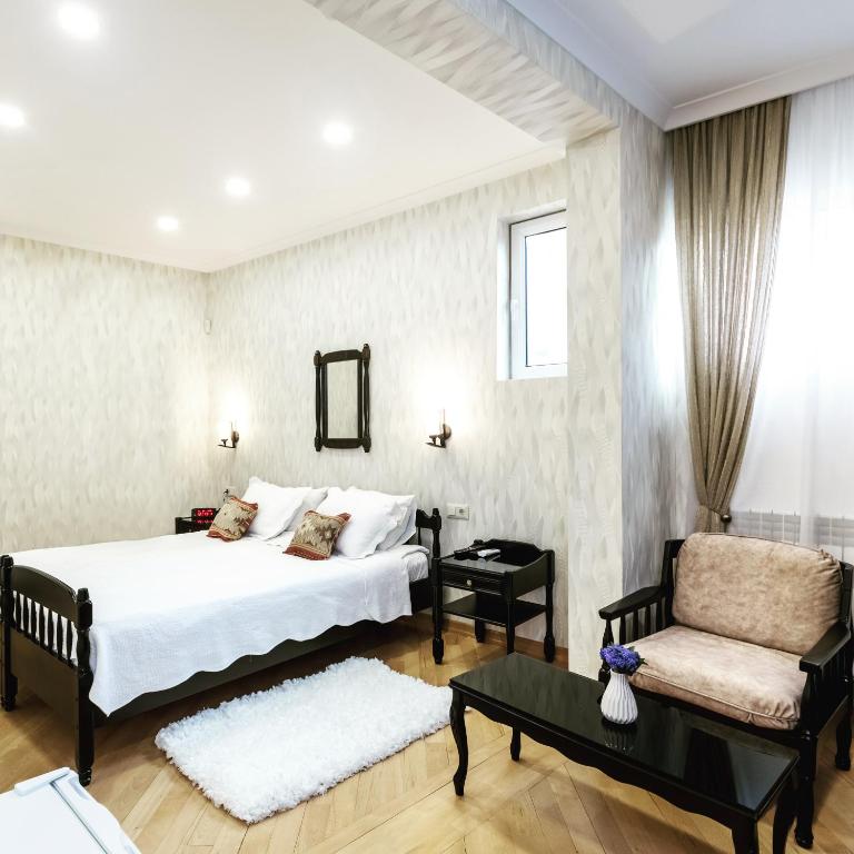 Postel nebo postele na pokoji v ubytování Q&B House