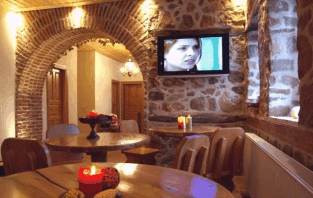 TV a/nebo společenská místnost v ubytování Nimbus Guesthouse