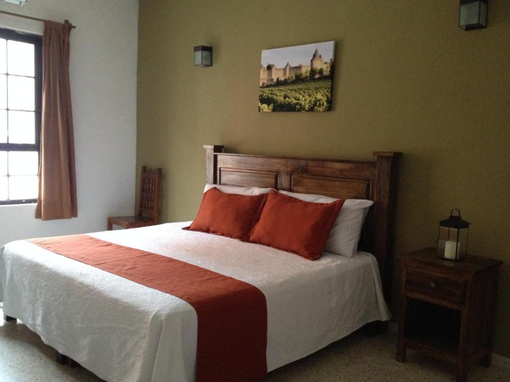 Postel nebo postele na pokoji v ubytování Hotel Casa de Vino