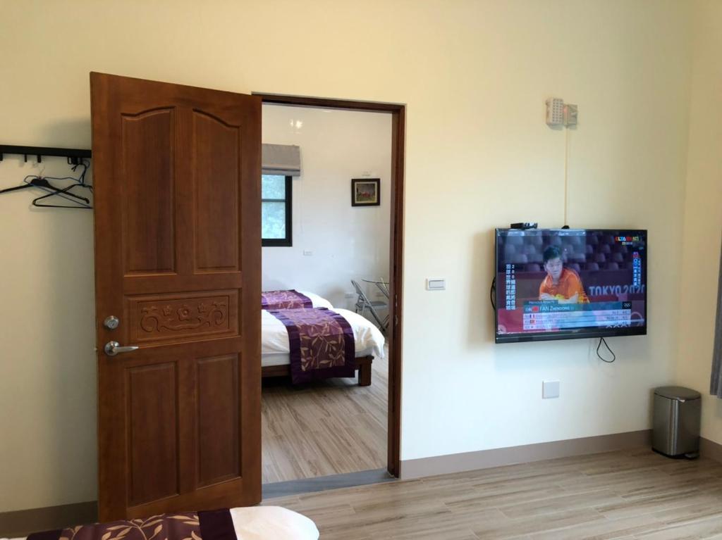 Voodi või voodid majutusasutuse Longtian Prosperity BnB toas