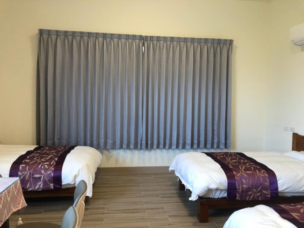 Voodi või voodid majutusasutuse Longtian Prosperity BnB toas