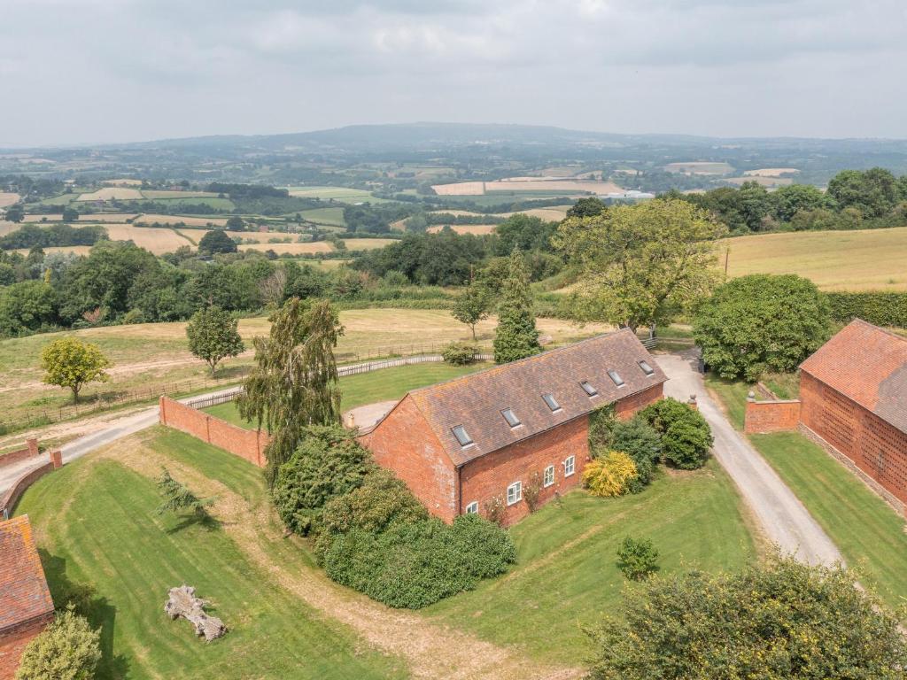 an aerial view of a brick building with trees at Hunters Moon in Tenbury