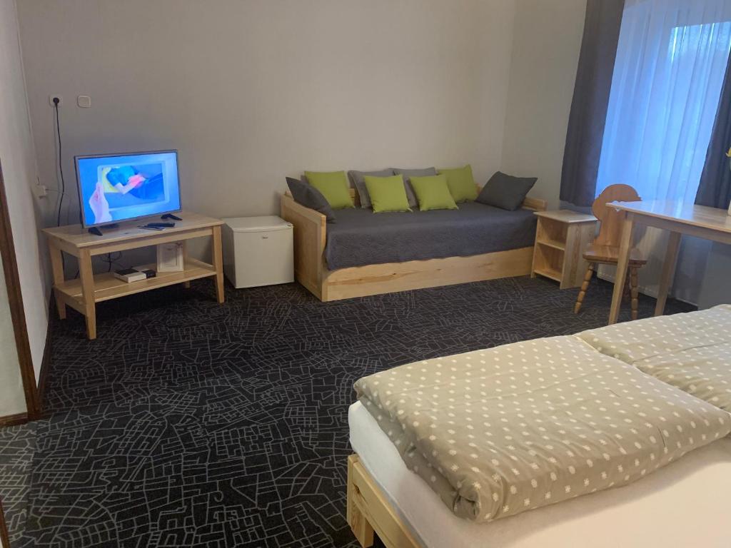 Posteľ alebo postele v izbe v ubytovaní Łomniczanka