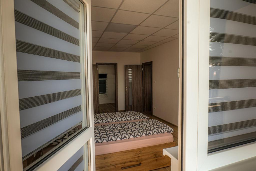 Postel nebo postele na pokoji v ubytování Apartmany Motocentrum