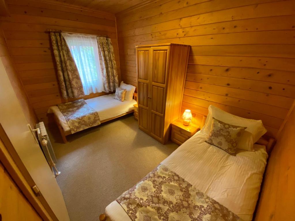 Postel nebo postele na pokoji v ubytování Alpin Borovets, Алпин Боровец