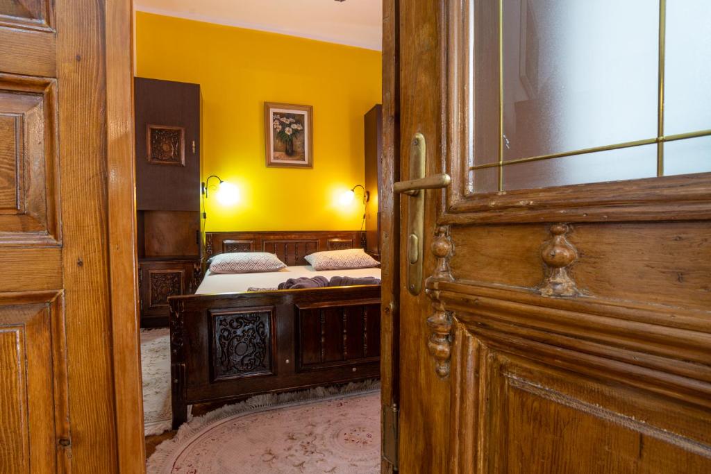an open door to a room with two beds at Unique Old Town Home 2min to Beach and Harbour Private Entrance in Constanţa