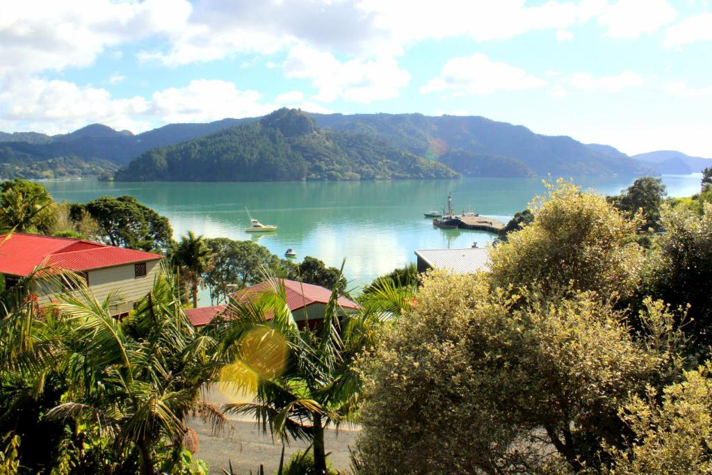 a large body of water with a boat in it at Sunseeker Lodge in Whangaroa