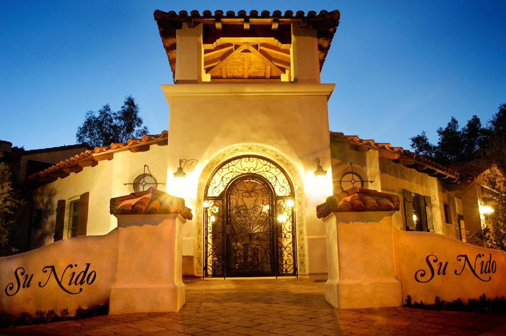 a building with a large door in front of it at Su Nido Inn in Ojai