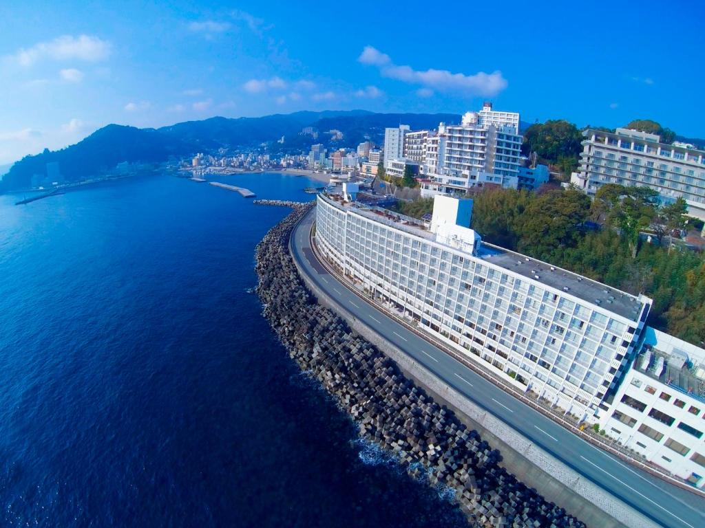 an aerial view of a large building next to the water at Hotel Resorpia Atami in Atami