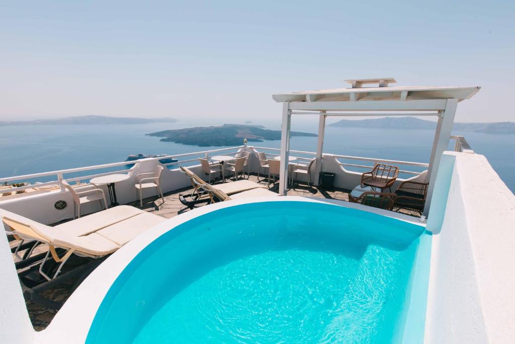 a swimming pool on the deck of a cruise ship at Kafieris View in Firostefani