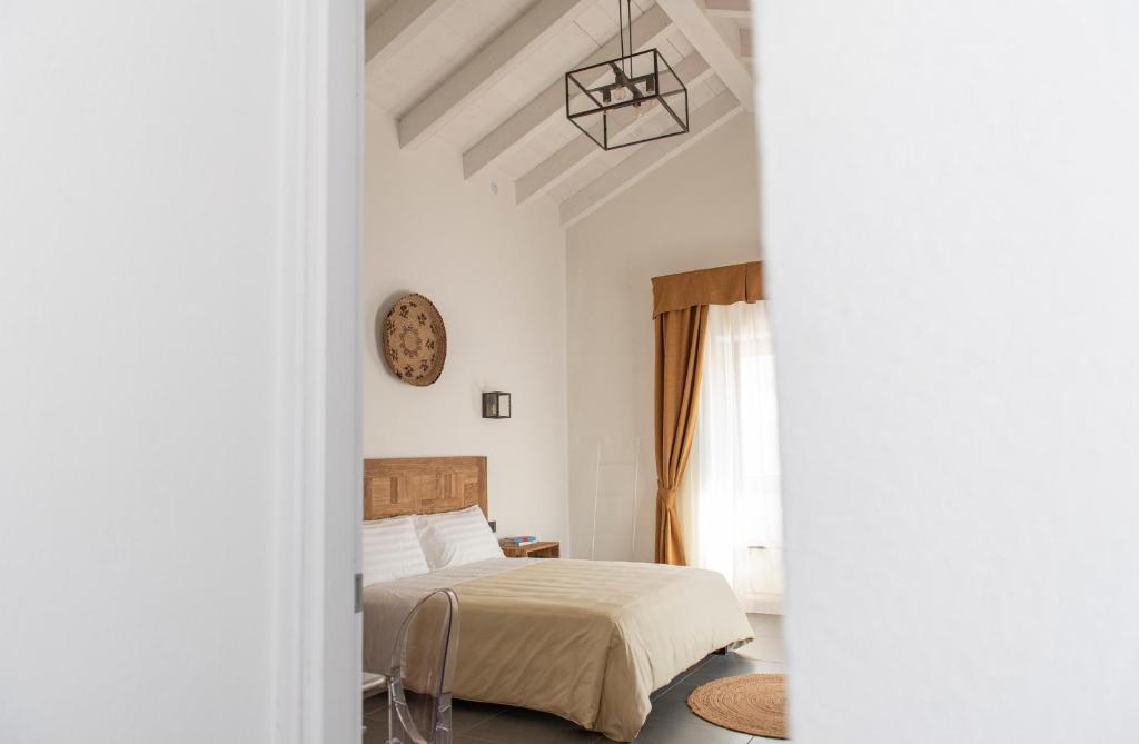 Postel nebo postele na pokoji v ubytování Albergo Rurale Casa Fois