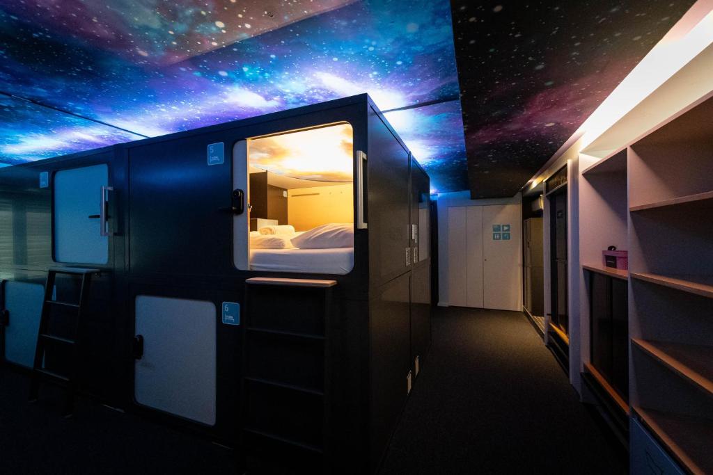 a room with a room with a starry ceiling at Capsule Hotel - theLAB in Luzern