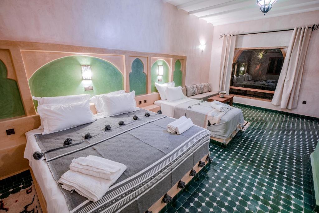 Postel nebo postele na pokoji v ubytování Hassilabiad Appart Hotel