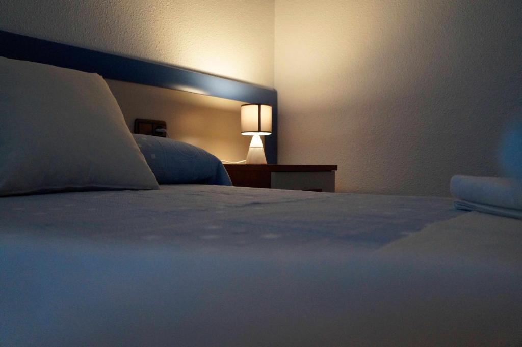 Ένα ή περισσότερα κρεβάτια σε δωμάτιο στο Apartamento Turístico Almagre