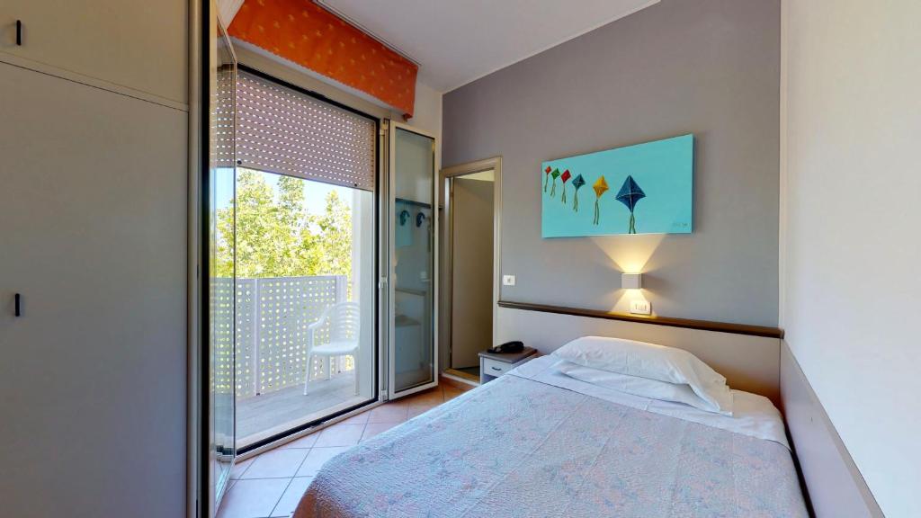 Posteľ alebo postele v izbe v ubytovaní Hotel Excelsior