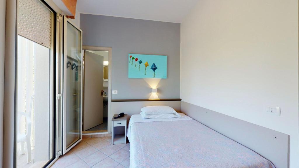 Posteľ alebo postele v izbe v ubytovaní Hotel Excelsior