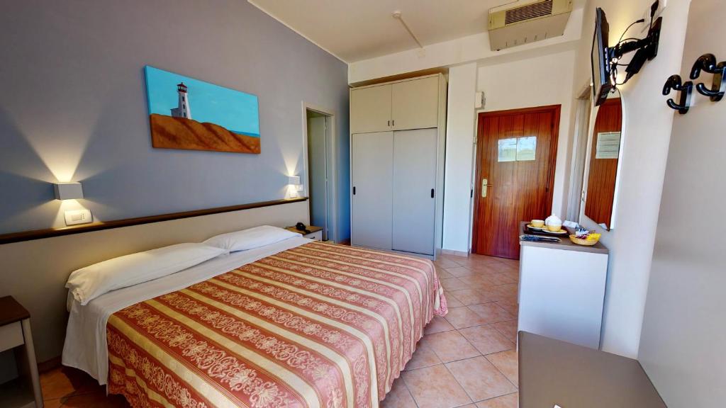 Posteľ alebo postele v izbe v ubytovaní Hotel Excelsior