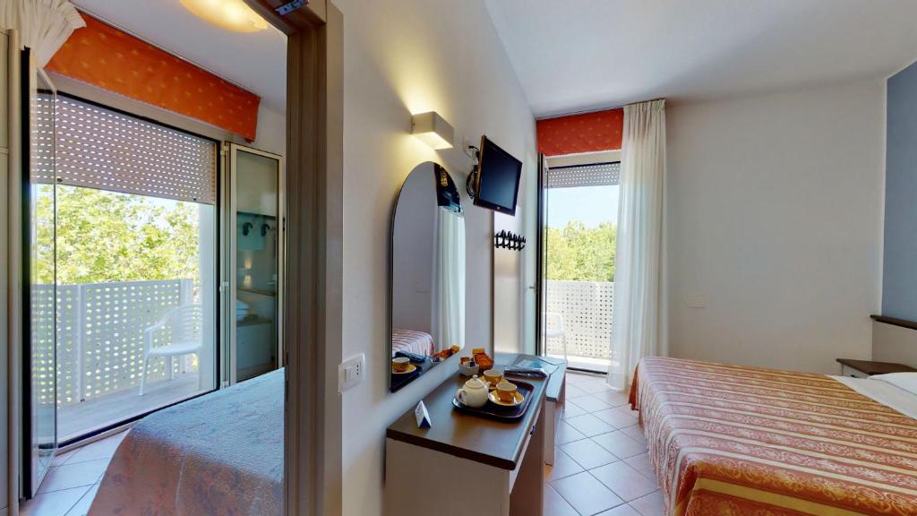 Posteľ alebo postele v izbe v ubytovaní Hotel Excelsior