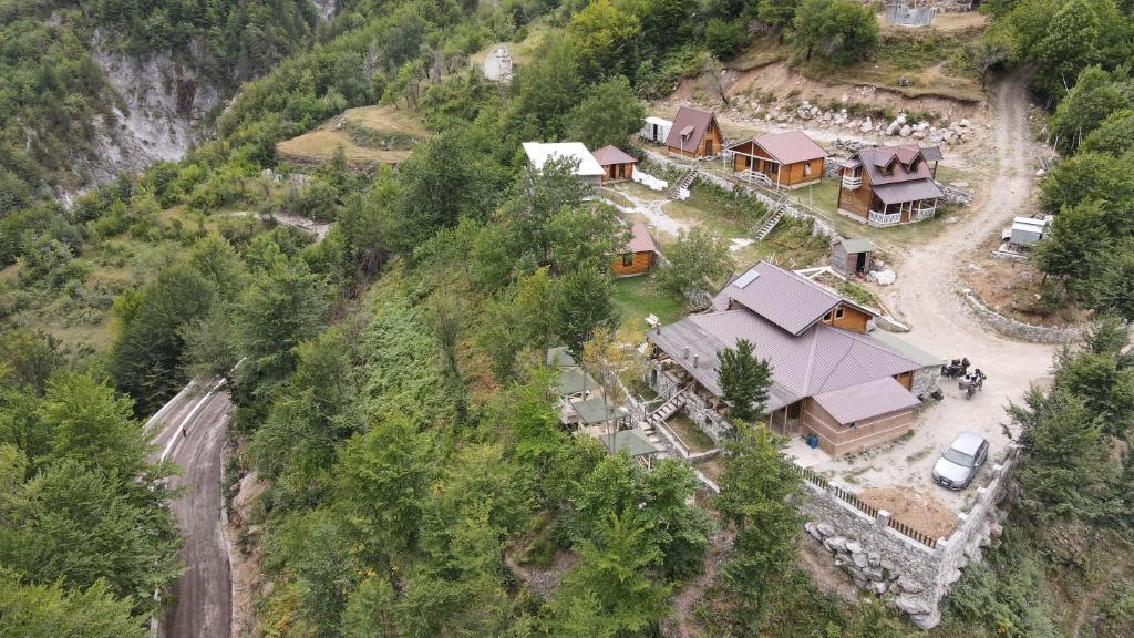 an aerial view of a house on a mountain at Thethi Paradise in Theth